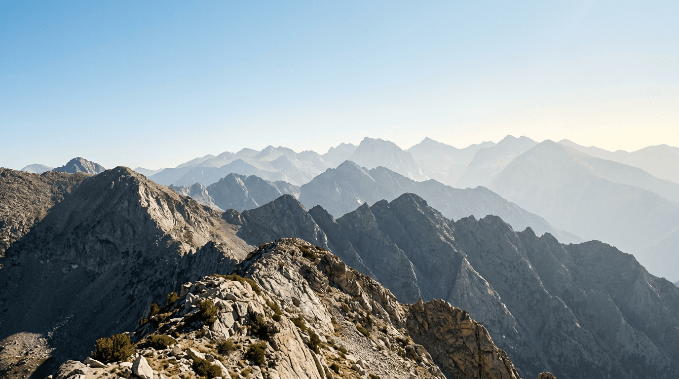 Layered granite ridgelines receding into clear morning light